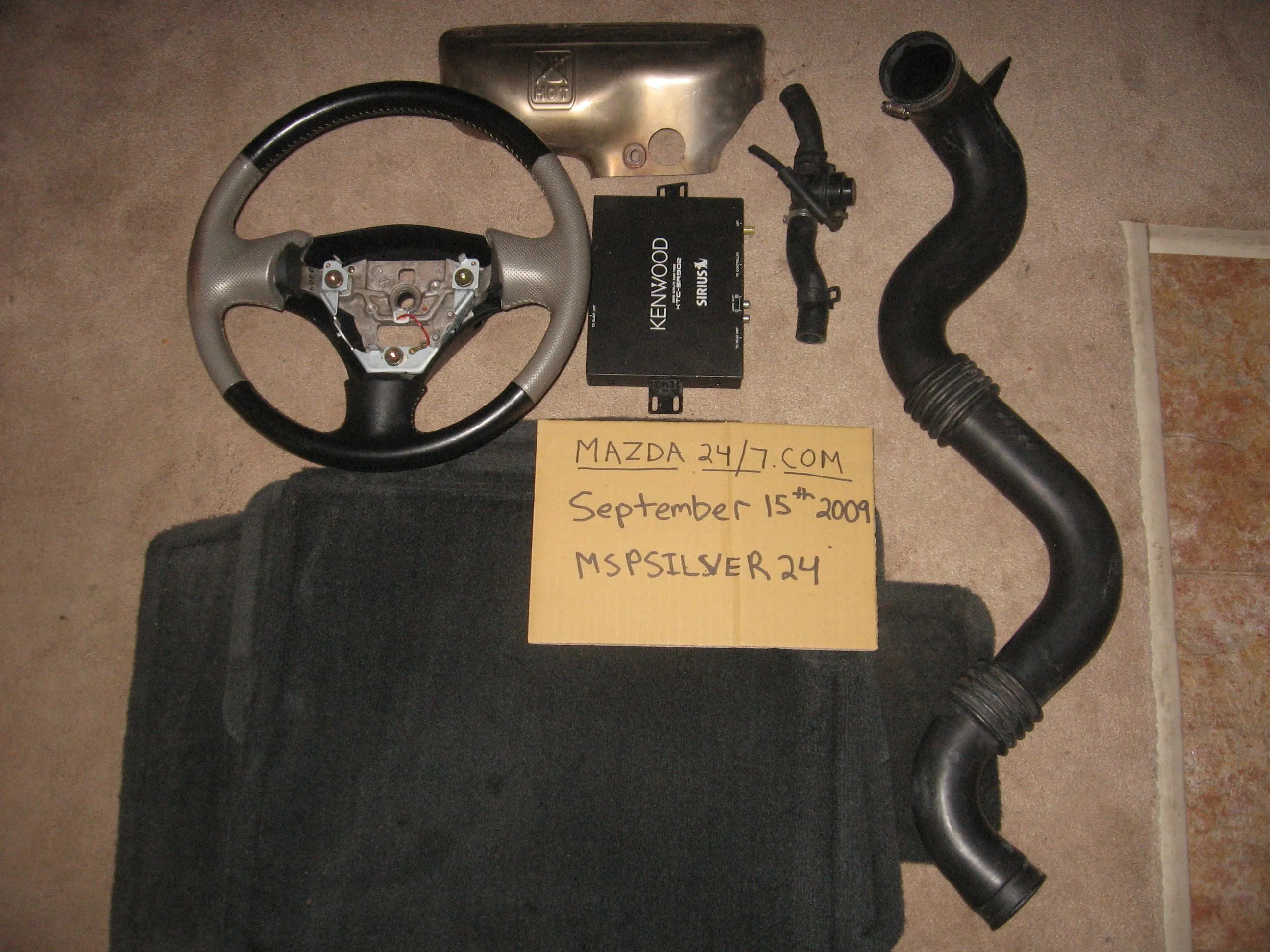 Mazdaspeed protege part out (steering wheel, floor mats, sirius box, intercooler,bov