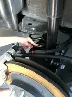 Son Showing Rear H&R Spring.webp