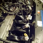 manifold with injectors in car.webp