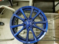 Emilia - OEM Wheel Powdercoated Volk Mag Blue with Custom Painted Center Cap.webp