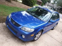 2003Mazda $750- P5 RSide.webp