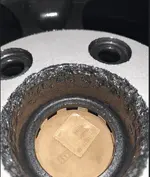 mazda wheel deeply gouged by sandblast.webp
