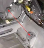 Inner drivers seat rail attachment points without carpet.webp