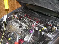 engine bay with ground wires.webp