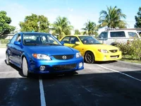 mazda mp3 '02 yellow and blue.webp