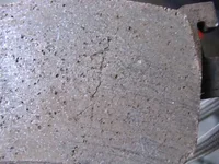 OEM_Front_Pad_Cracked_Surface_Closeup.webp