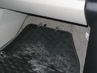 Passenger side floor mat retainer.webp