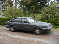 MazdaGreyOnCornerDirty.webp