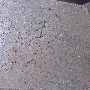 OEM_Front_Pad_Cracked_Surface_Closeup.webp