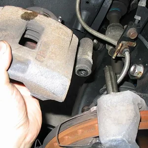 06 Drivers Front Caliper Removed From Slider.webp