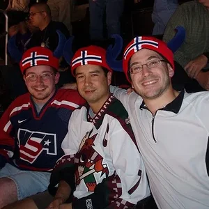 Guys at hockey game.webp