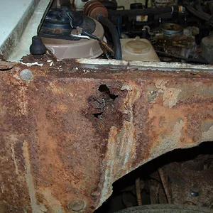 Mazda 1200 rust in front structure.JPG