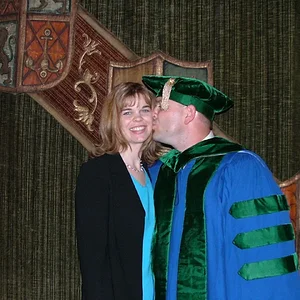 Graduation Tim kissing Kris.JPG