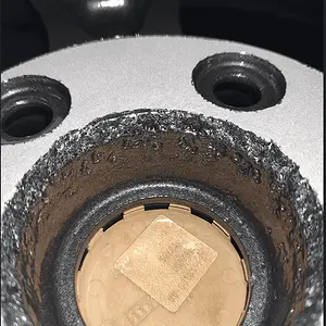 mazda wheel deeply gouged by sandblast.png