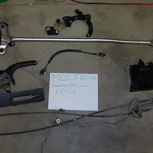 strut bar, ebrake, storage bin, throttle cable.webp