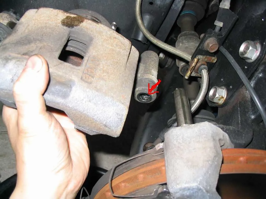 06 Drivers Front Caliper Removed From Slider.jpg