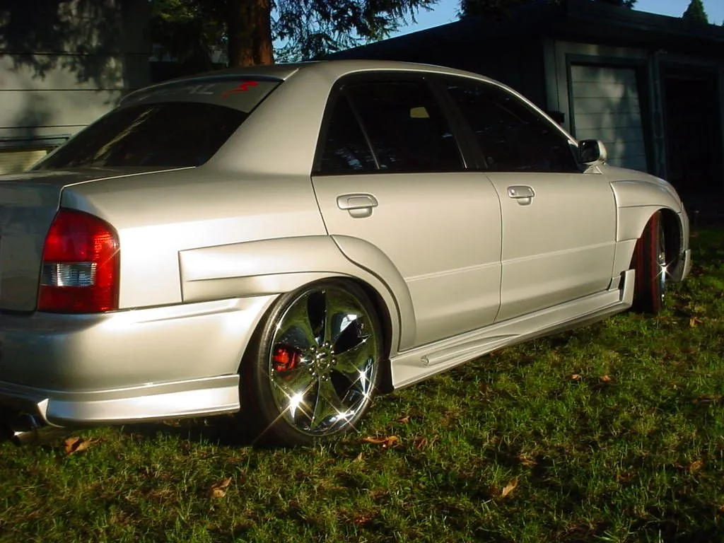 deans car front yard corner.JPG