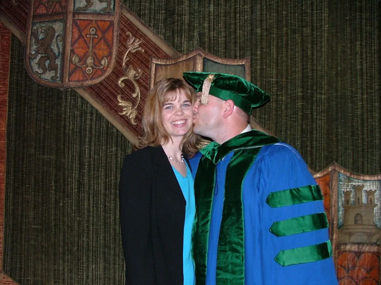 Graduation Tim kissing Kris.JPG