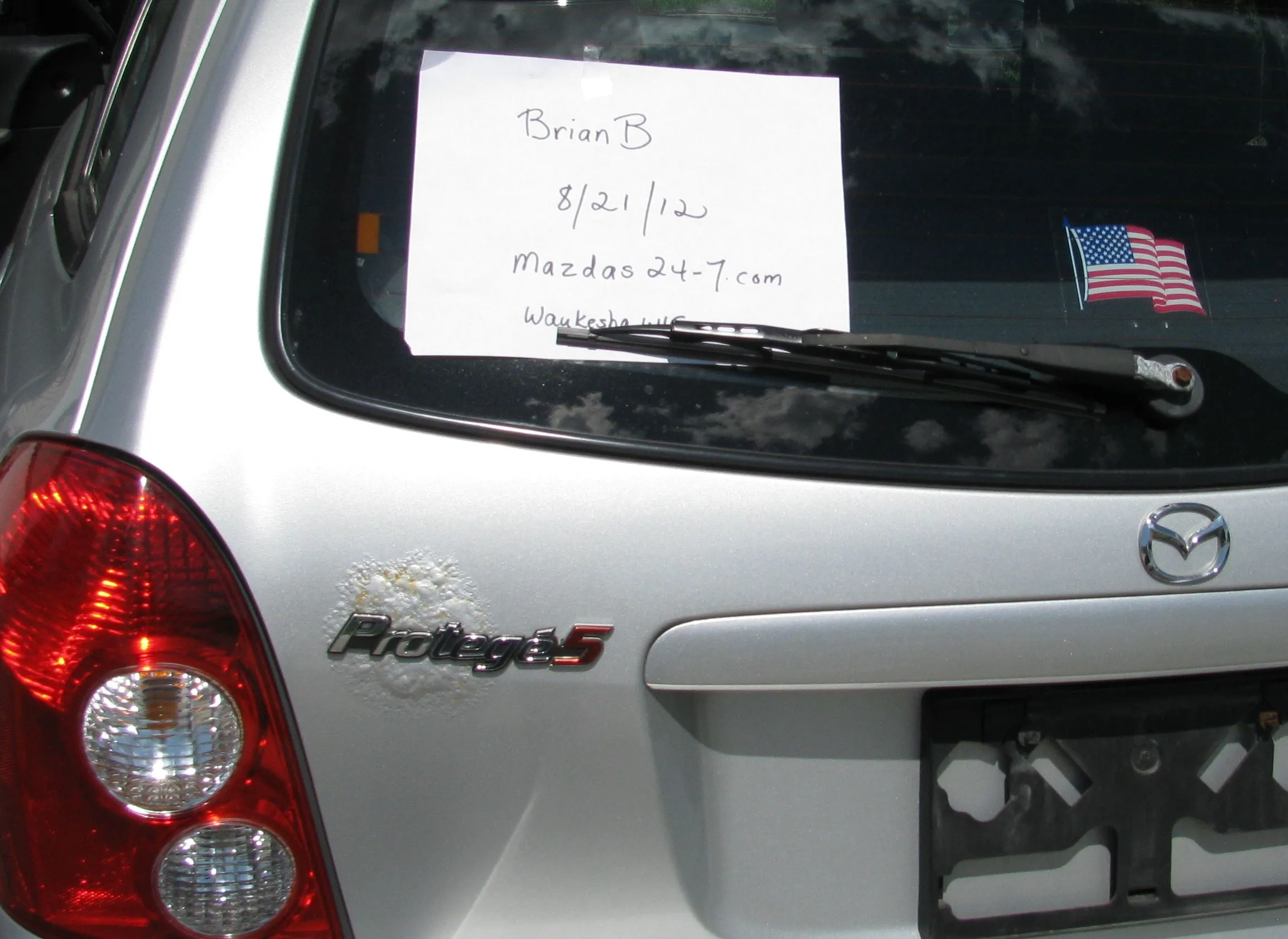 Mazda photos for Mazdas247.com  rust bubble in back.webp