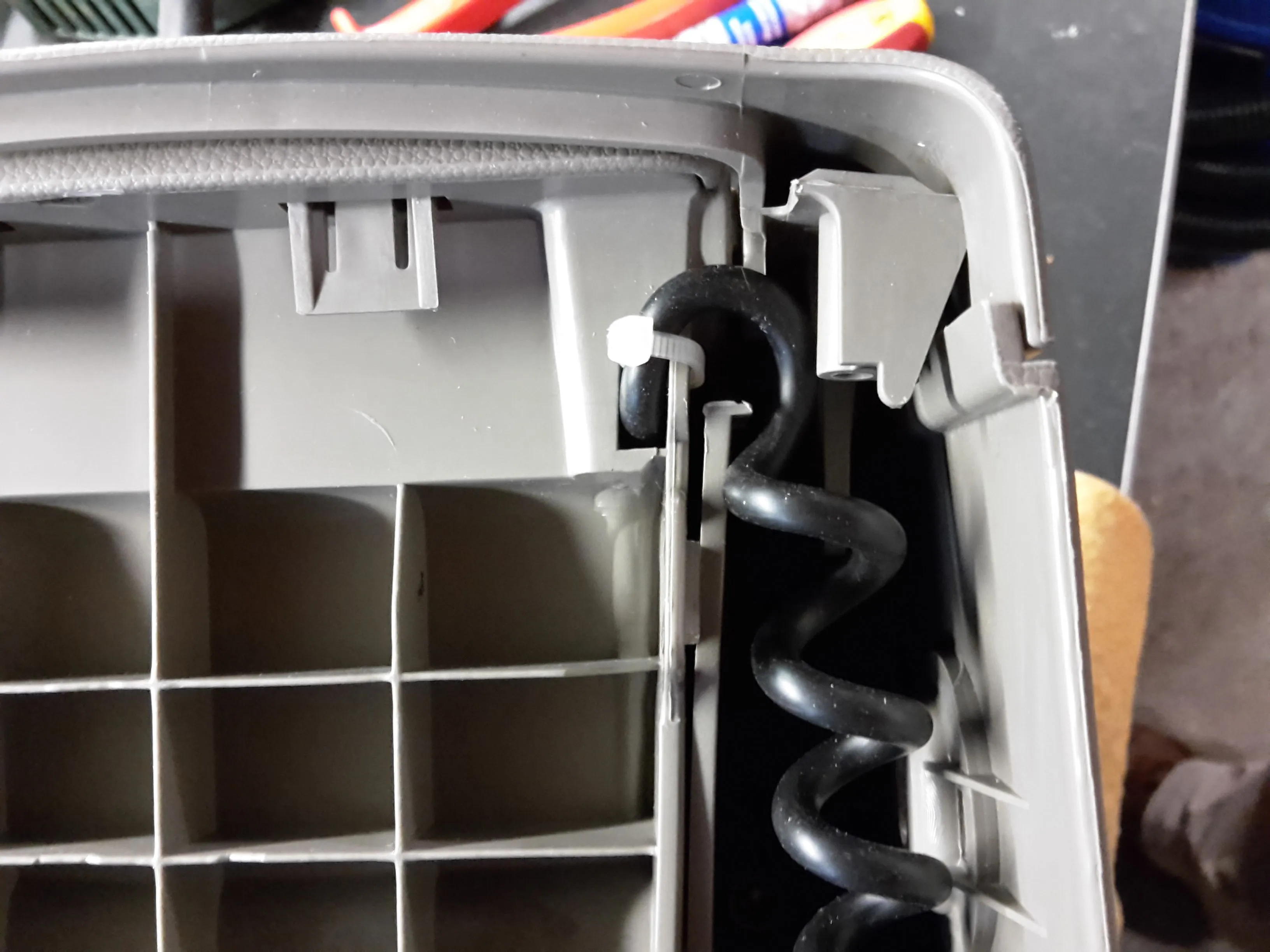 Reattached the cupholder-assembly to the console.jpg