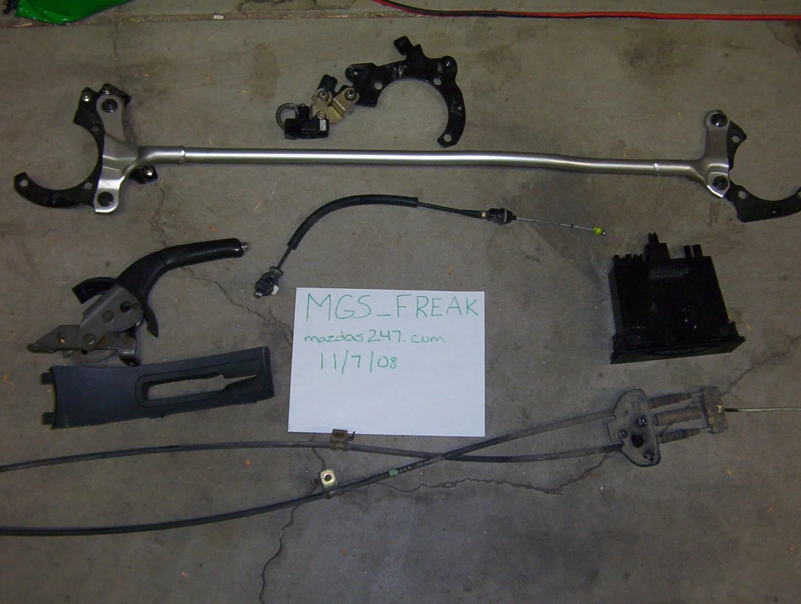 strut bar, ebrake, storage bin, throttle cable.webp