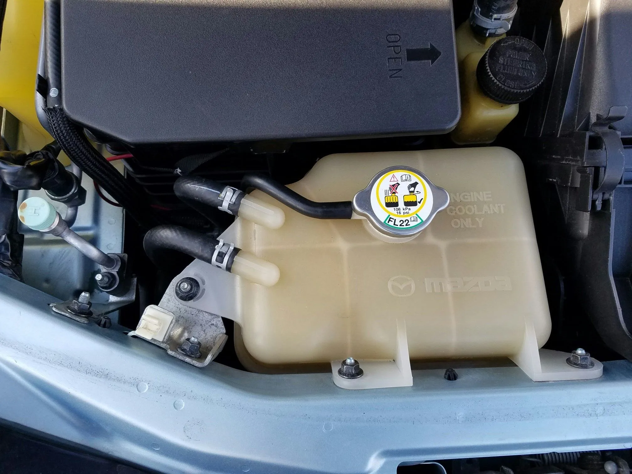 Emilia - Stock Nuts - Coolant Tank and AC Bracket.jpeg