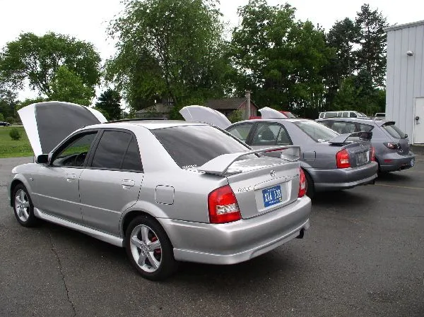 group leaders open hoods.webp