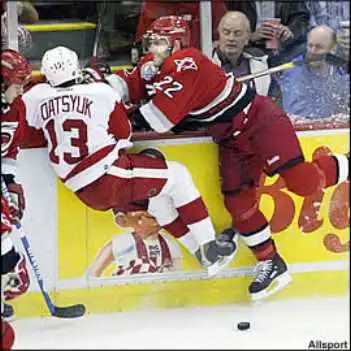 hill_checks_datsyuk.jpg