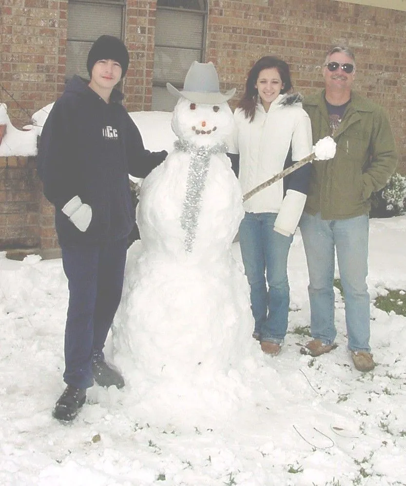 kids with snowman2.webp