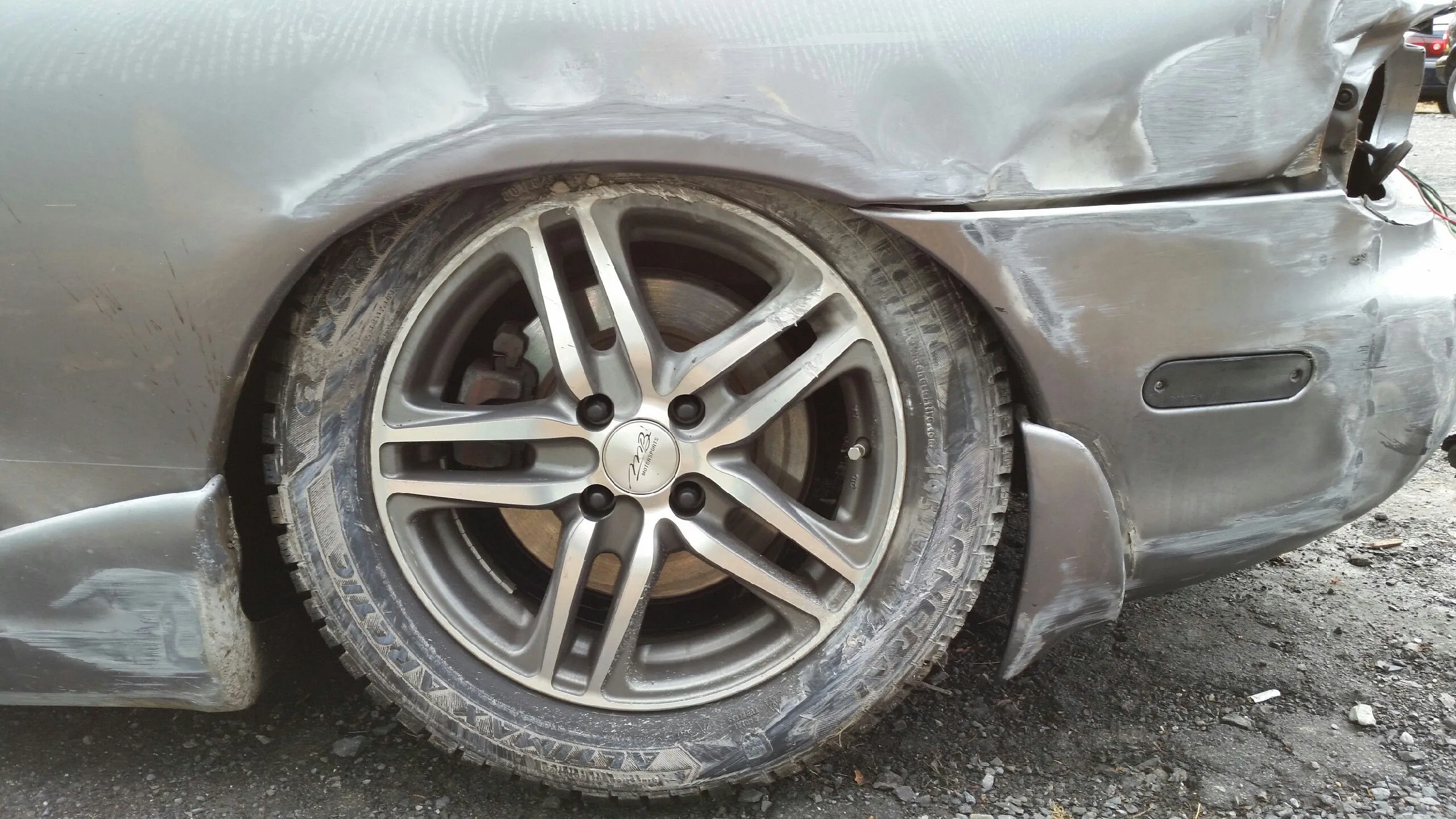 Lexi - Accident 12-17-14 Wheel and Tire.jpeg