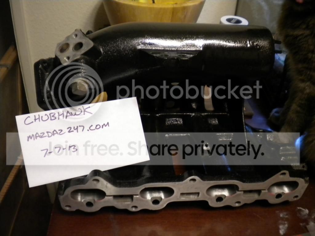 ported polished 626 manifold coated black with matching TB and braided oil line