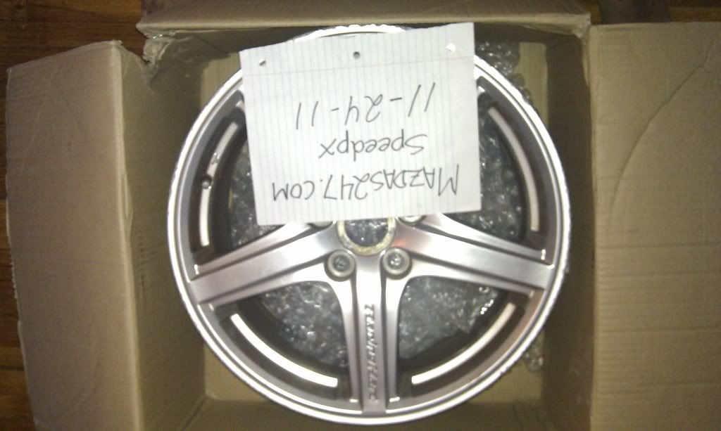 2 Mazdaspeed protege racing hart rims (dark gray) 1 racing hart (clear gray)